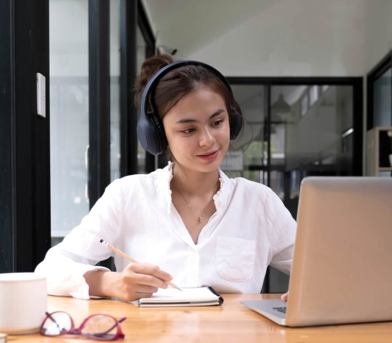 asian-woman-interpreter-write-translation-from-foreign-language-to-english-listen-to-audio-record-in.jpg